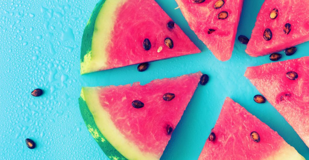 slices of melon on  blue background